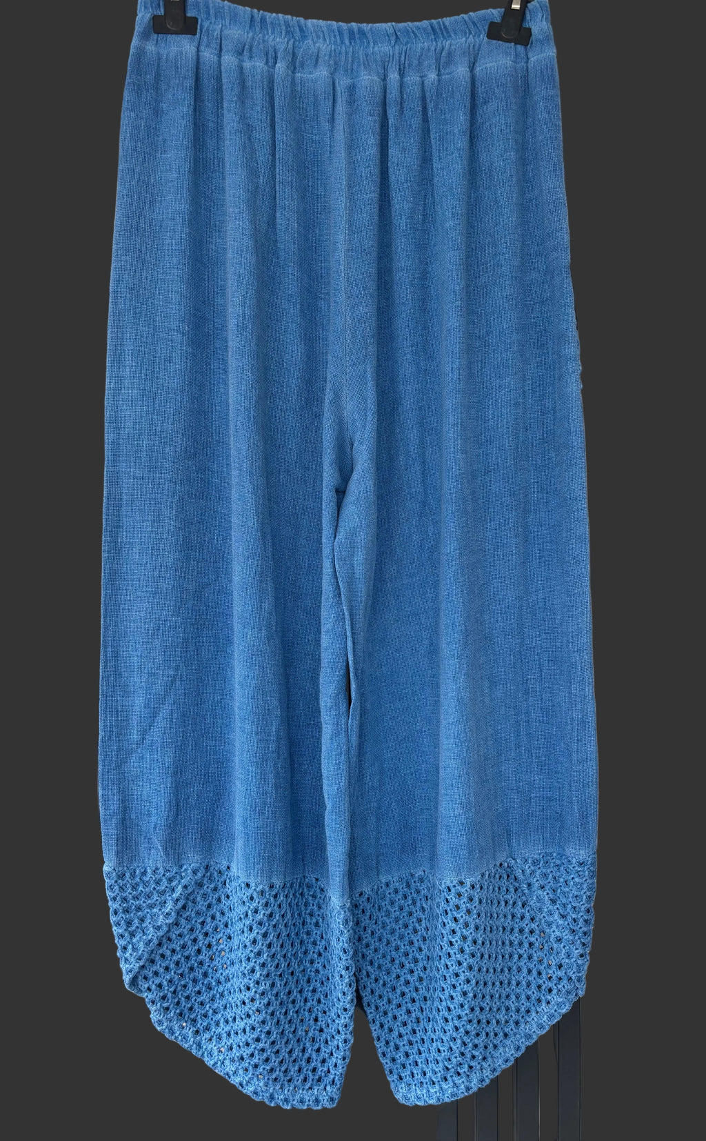 Blue pants with textured bottom hem 