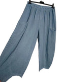 Light blue wide-leg cropped pants with an elastic waistband, hanging on a black hanger against a white background