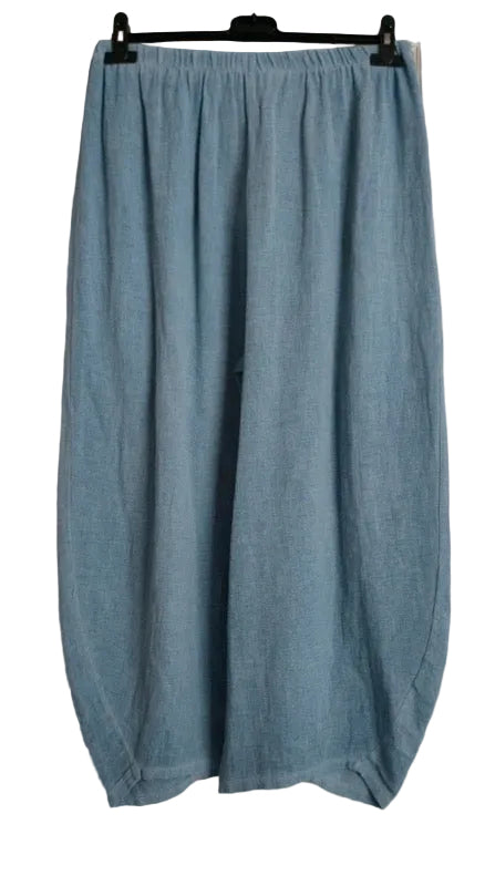 Light blue linen wide-leg pants hanging on a black hanger against a white background